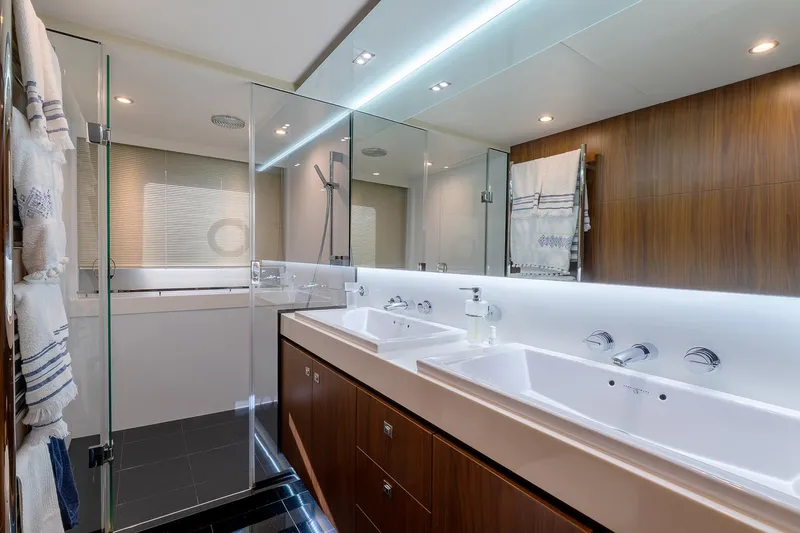  Yacht Photos Pics Luxurious bathroom in a 2014 Princess 72 Motor Yacht with dual sinks and modern design.