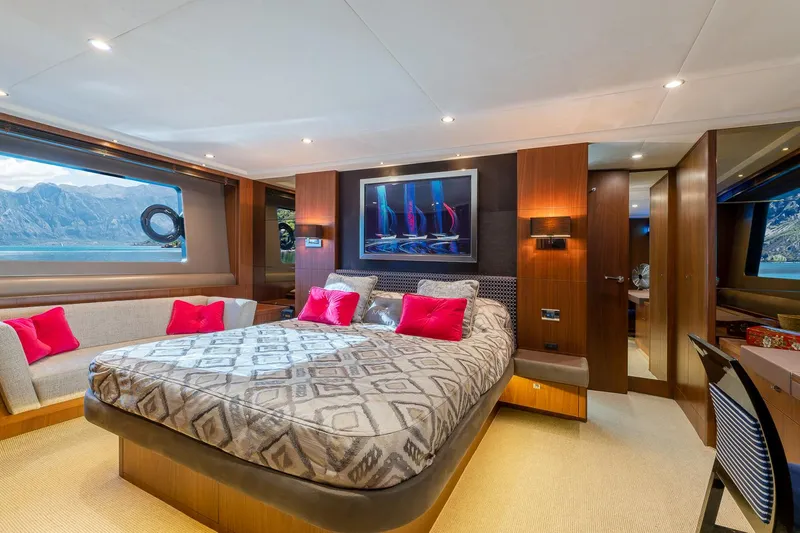  Yacht Photos Pics Luxurious bedroom interior of 2014 Princess 72 Motor Yacht with modern decor and scenic window view.