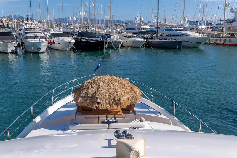  Yacht Photos Pics Princess 72 Motor Yacht, 2014, docked in a marina with other luxury boats.