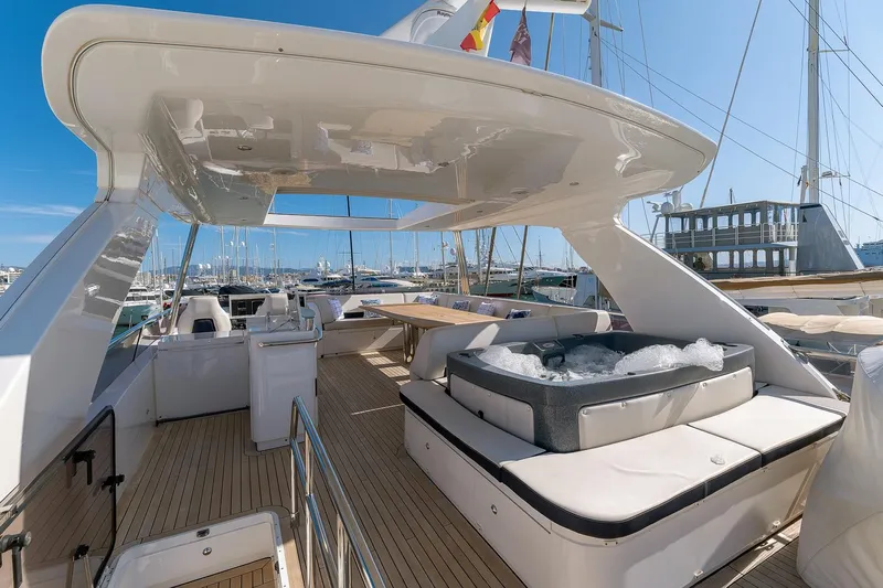  Yacht Photos Pics Luxurious 2014 Princess 72 Motor Yacht with spacious deck and jacuzzi, docked at marina.