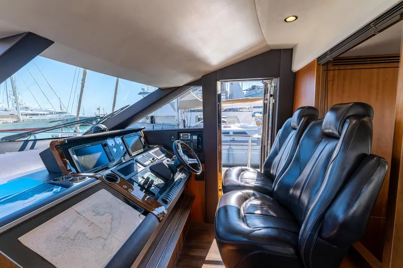  Yacht Photos Pics Interior helm of 2014 Princess 72 Motor Yacht with leather seats and navigation equipment.