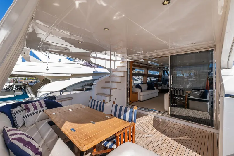  Yacht Photos Pics Luxurious 2014 Princess 72 Motor Yacht with elegant outdoor seating and modern interior.