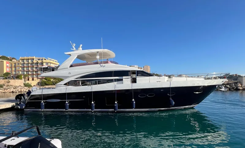  Yacht Photos Pics 2014 Princess 72 Motor Yacht docked in a sunny marina.