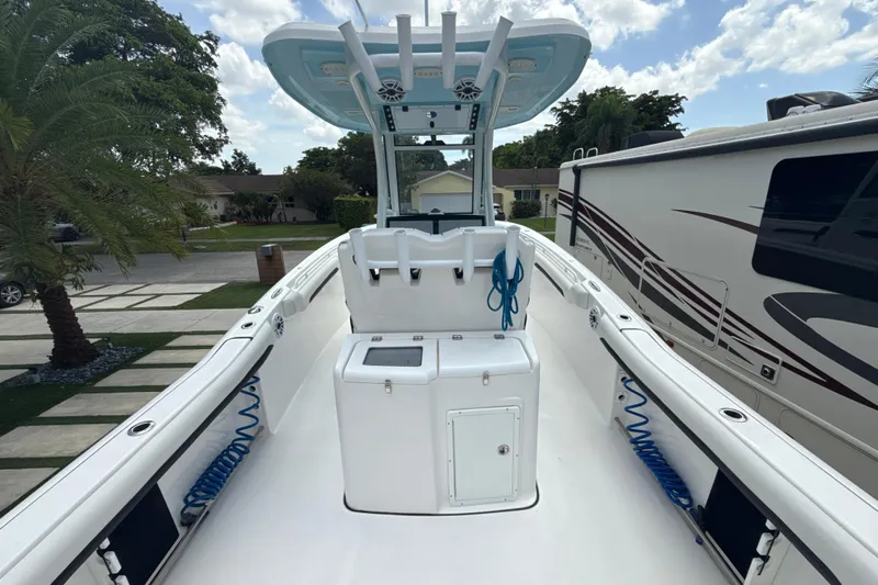  Yacht Photos Pics 2022 Tidewater 280 CC Adventure boat with spacious deck and modern amenities.