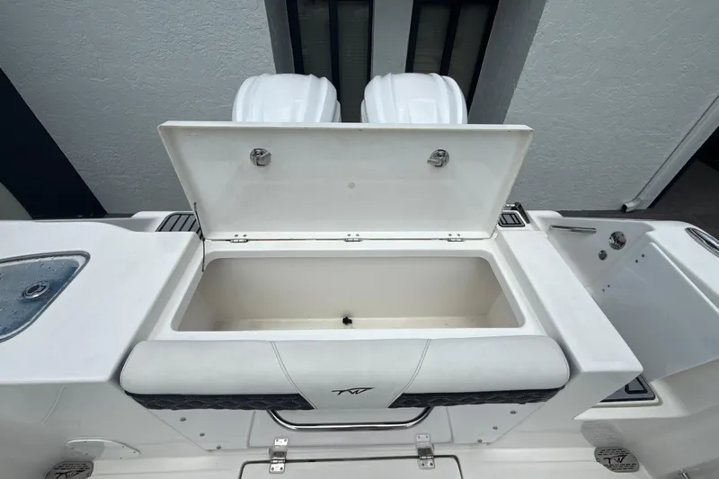  Yacht Photos Pics 2022 Tidewater 280 CC Adventure boat with open storage compartment.