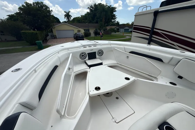  Yacht Photos Pics 2022 Tidewater 280 CC Adventure boat interior with seating and storage compartments.