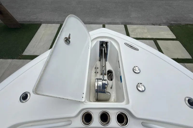  Yacht Photos Pics 2022 Tidewater 280 CC Adventure boat anchor compartment with open hatch.