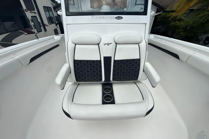  Yacht Photos Pics 2022 Tidewater 280 CC Adventure boat seating with cup holders and stylish upholstery.