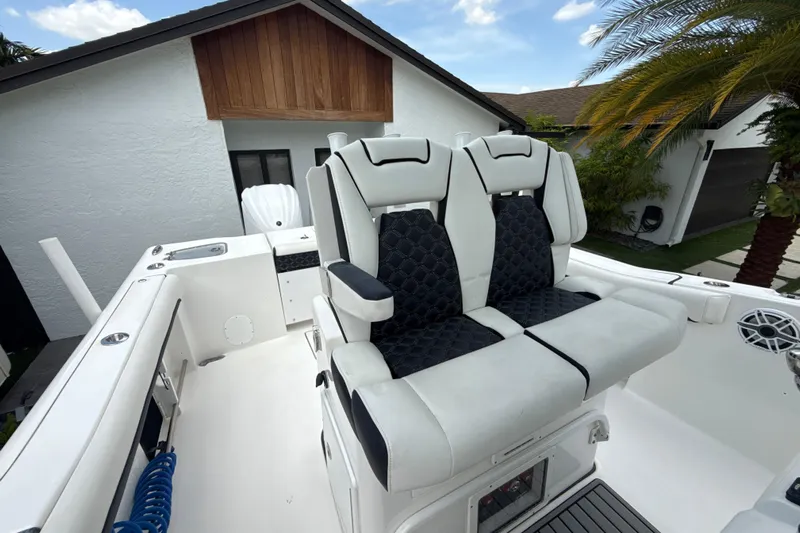  Yacht Photos Pics 2022 Tidewater 280 CC Adventure boat with luxurious seating and modern design.