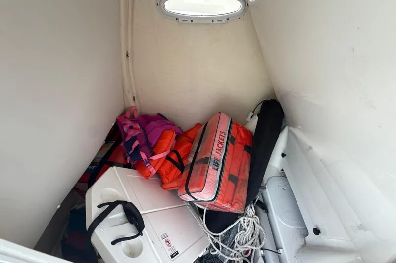 Yacht Photos Pics Storage area in 2022 Tidewater 280 CC Adventure with life jackets and equipment.