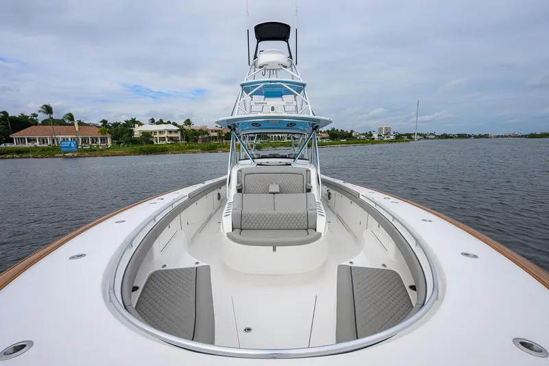 Patriot Yacht Photos Pics 2023 Valhalla Boatworks yacht with spacious deck and luxurious seating on calm waters.