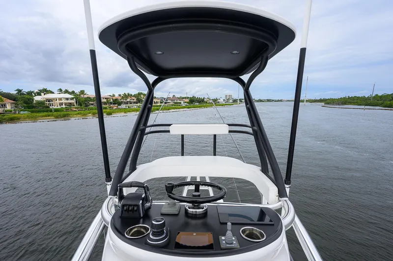 Patriot Yacht Photos Pics 2023 Valhalla Boatworks helm view, featuring modern controls and scenic waterfront backdrop.