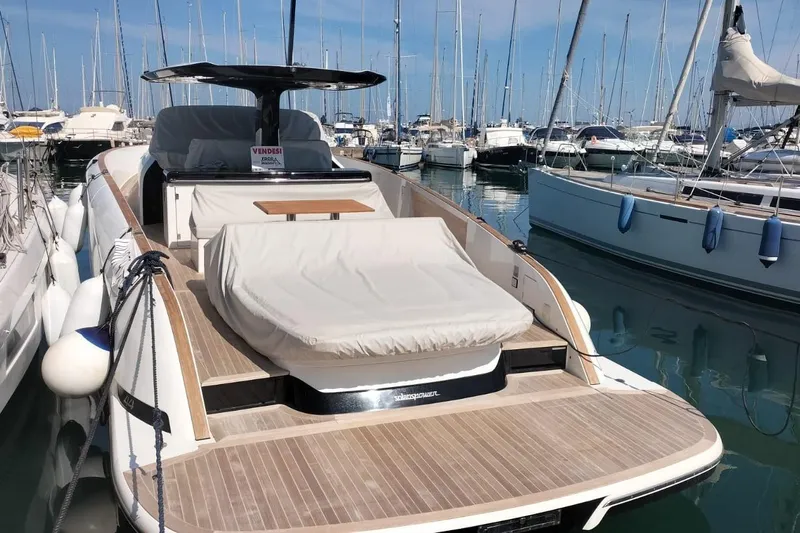  Yacht Photos Pics 2024 Solaris Power 44 Open yacht docked in a marina, showcasing sleek design and luxury features.