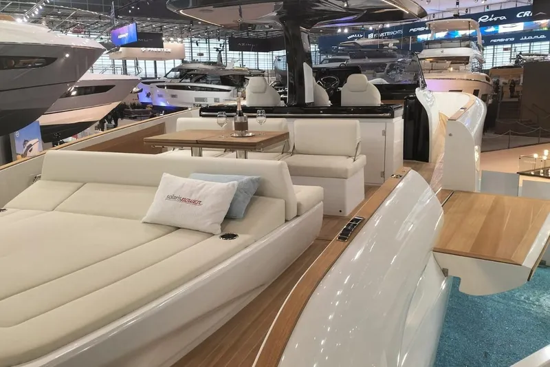  Yacht Photos Pics 2024 Solaris Power 44 Open luxury yacht interior with elegant seating and dining area.
