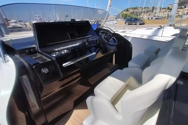  Yacht Photos Pics 2024 Solaris Power 44 Open yacht cockpit with modern steering and seating.