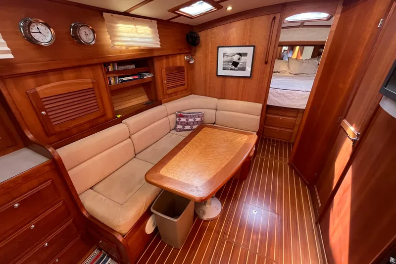 Shibumi Yacht Photos Pics Luxurious interior of 2004 Sabre 42 Hardtop Express yacht with wood finish and cozy seating.