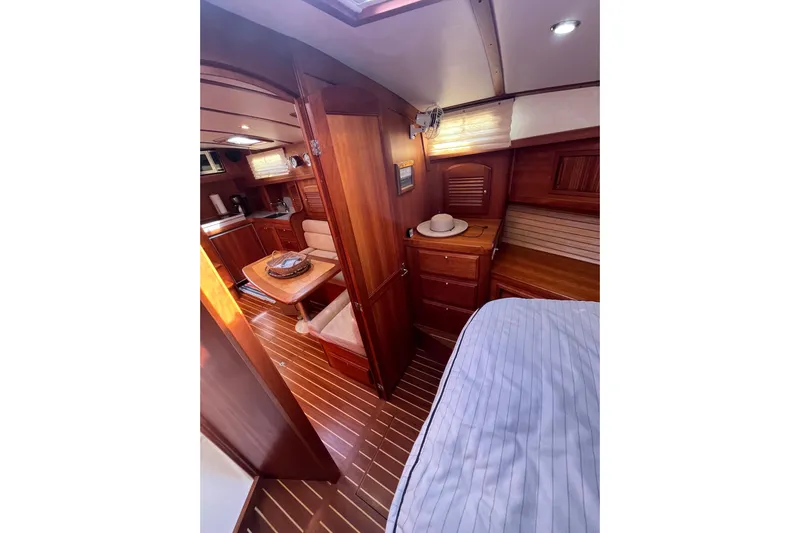 Shibumi Yacht Photos Pics Interior of 2004 Sabre 42 Hardtop Express yacht with wood finish and cozy seating area.
