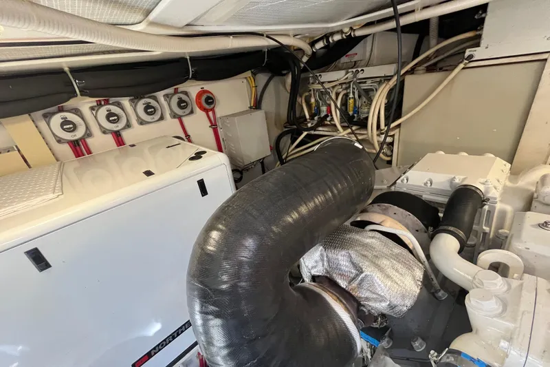 Shibumi Yacht Photos Pics Engine room of 2004 Sabre 42 Hardtop Express with visible machinery and wiring.