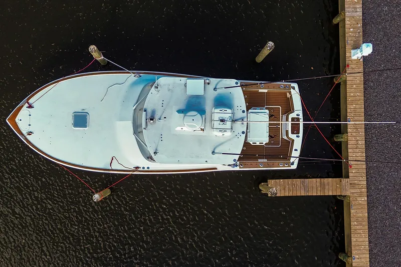  Yacht Photos Pics Aerial view of 2005 Buddy Davis 35' Express boat docked at a wooden pier.
