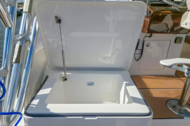  Yacht Photos Pics Open storage compartment on a 2005 Buddy Davis 35' Express boat deck.
