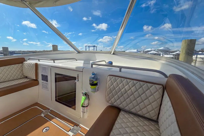  Yacht Photos Pics 2005 Buddy Davis 35' Express boat interior with cushioned seating and clear sky view.