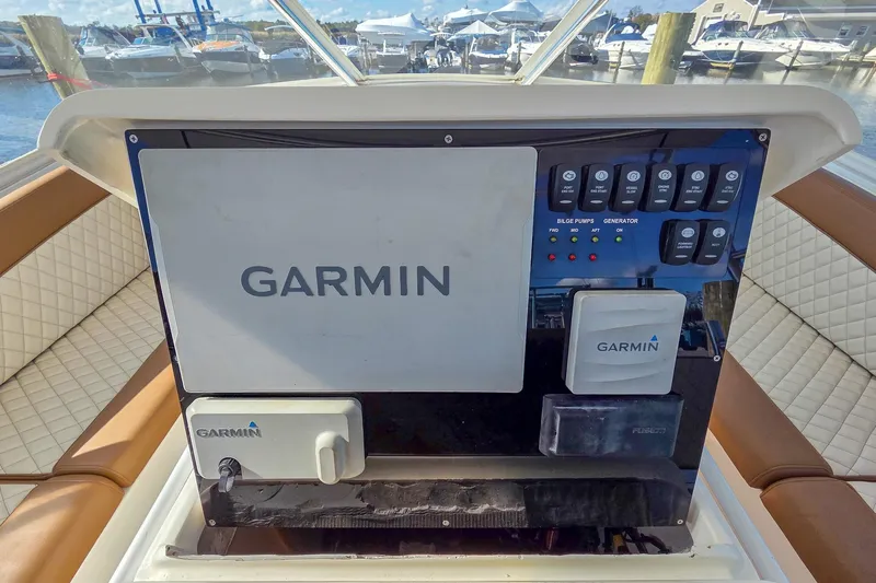  Yacht Photos Pics Control panel of a 2005 Buddy Davis 35' Express boat with Garmin electronics.