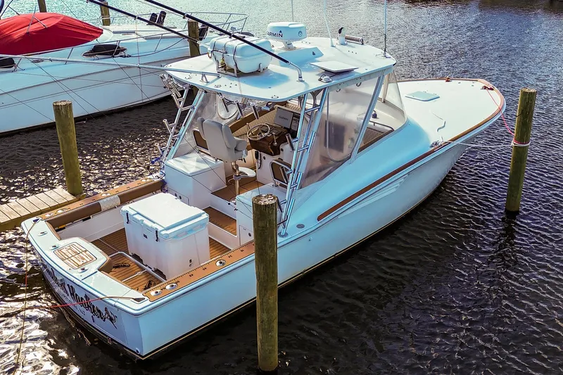  Yacht Photos Pics 2005 Buddy Davis 35' Express boat docked in marina, aerial view.