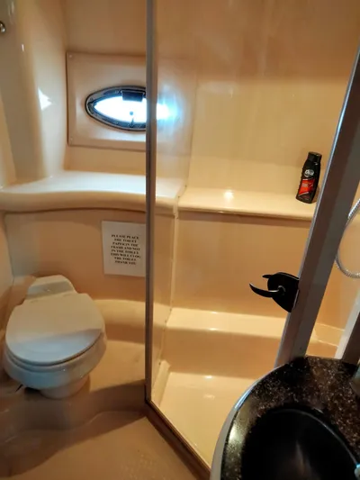 Sunshine Yacht Photos Pics Bathroom interior of 2005 Meridian 459 Motoryacht with shower and toilet.
