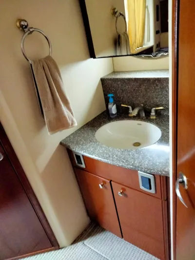 Sunshine Yacht Photos Pics Bathroom vanity in 2005 Meridian 459 Motoryacht with granite countertop and towel ring.