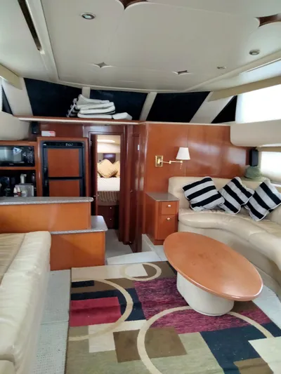 Sunshine Yacht Photos Pics Interior of 2005 Meridian 459 Motoryacht with modern furnishings and cozy seating area.