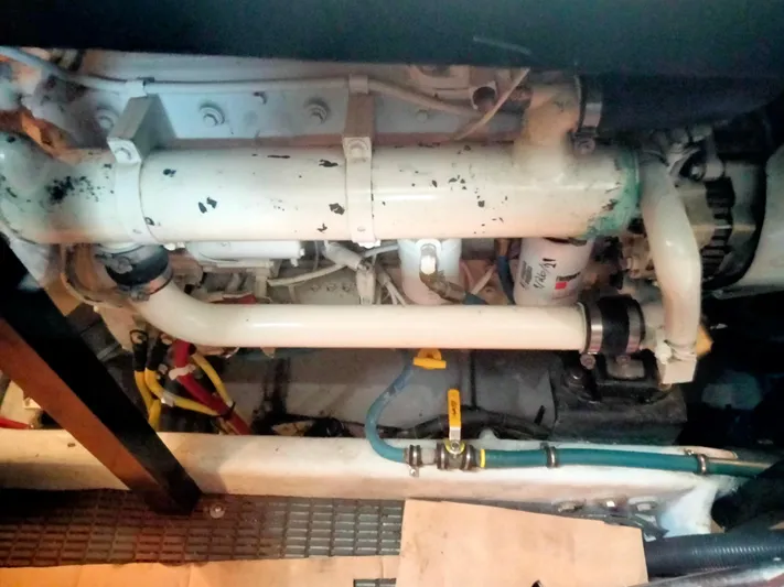 Sunshine Yacht Photos Pics Engine room of 2005 Meridian 459 Motoryacht with visible pipes and components.