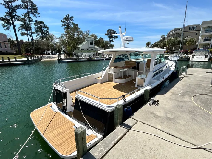  Yacht Photos Pics 2014 Back Cove Downeast 37 yacht docked in a sunny marina.
