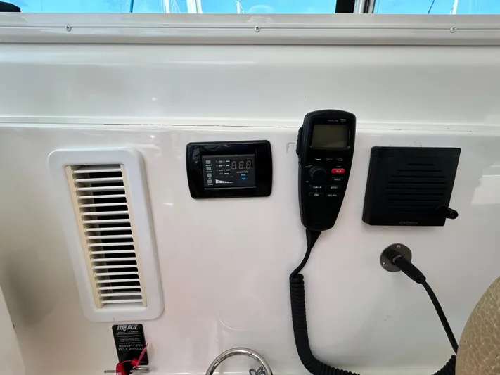 Yacht Photos Pics Control panel of a 2014 Back Cove Downeast 37 boat with communication equipment.