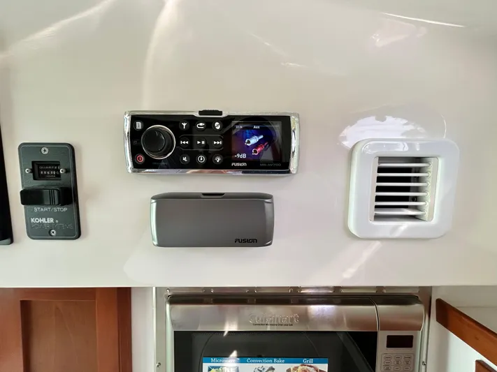  Yacht Photos Pics Control panel of a 2014 Back Cove Downeast 37 boat with audio system and vent.