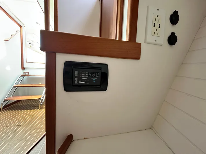  Yacht Photos Pics Interior of 2014 Back Cove Downeast 37 boat, featuring control panel and electrical outlets.