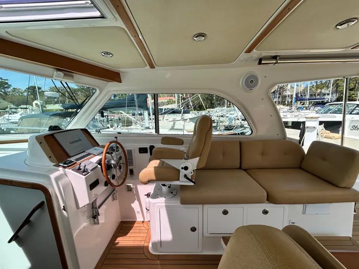  Yacht Photos Pics Interior of 2014 Back Cove Downeast 37 boat with helm and seating area.