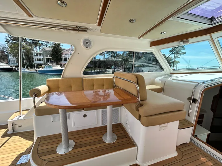  Yacht Photos Pics Interior of 2014 Back Cove Downeast 37 yacht with seating and table.