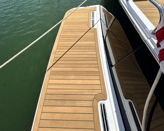  Yacht Photos Pics 2014 Back Cove Downeast 37 boat with teak deck, docked on calm water.