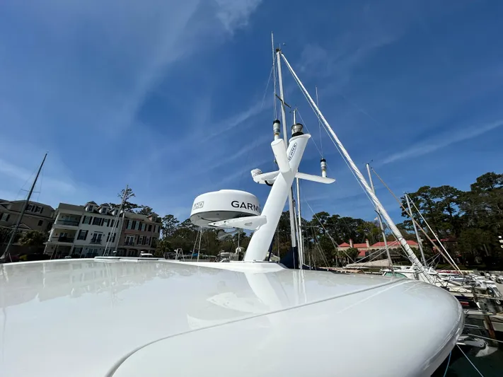  Yacht Photos Pics 2014 Back Cove Downeast 37 yacht with Garmin radar, docked under clear blue sky.