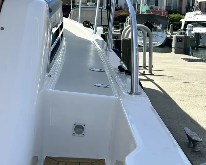  Yacht Photos Pics 2014 Back Cove Downeast 37 boat docked, showcasing sleek deck design and marina setting.