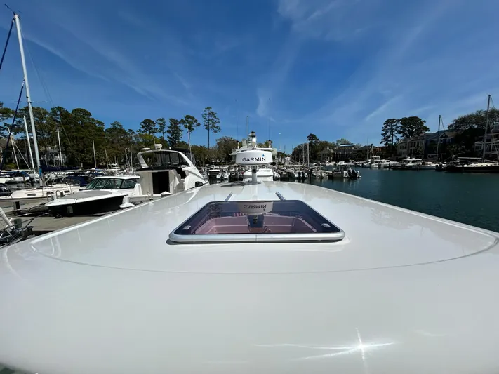  Yacht Photos Pics 2014 Back Cove Downeast 37 yacht docked in a marina under clear blue skies.