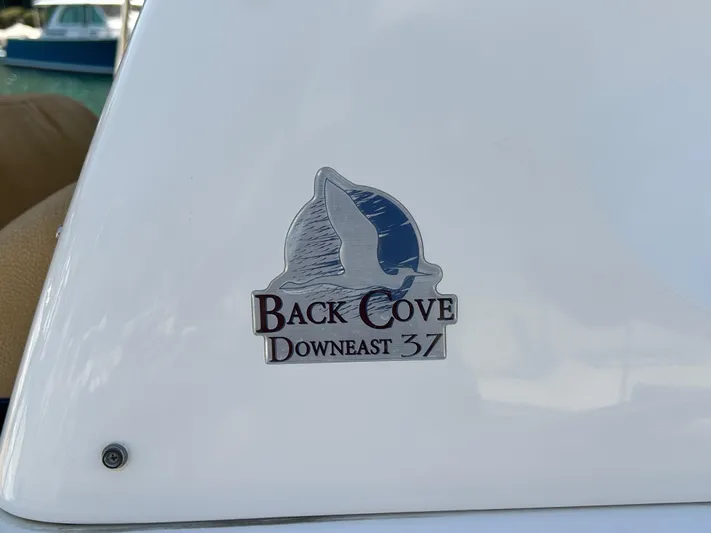  Yacht Photos Pics Back Cove Downeast 37 logo on a 2014 boat exterior.