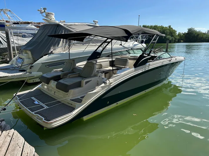 2022 Sea Ray 290 Sdx @ Cancun Yacht Photos Pics 2022 Sea Ray SDX 290 boat docked on calm water, featuring sleek design and spacious seating.