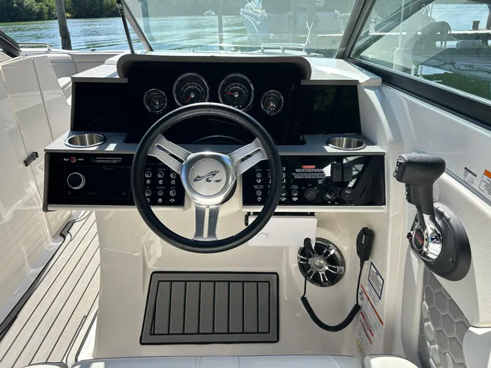 2022 Sea Ray 290 Sdx @ Cancun Yacht Photos Pics 2022 Sea Ray SDX 290 helm with steering wheel, gauges, and controls.