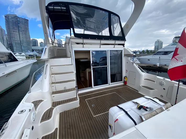  Yacht Photos Pics 2000 Sea Ray 450 Express Bridge yacht docked, featuring spacious deck and modern design.