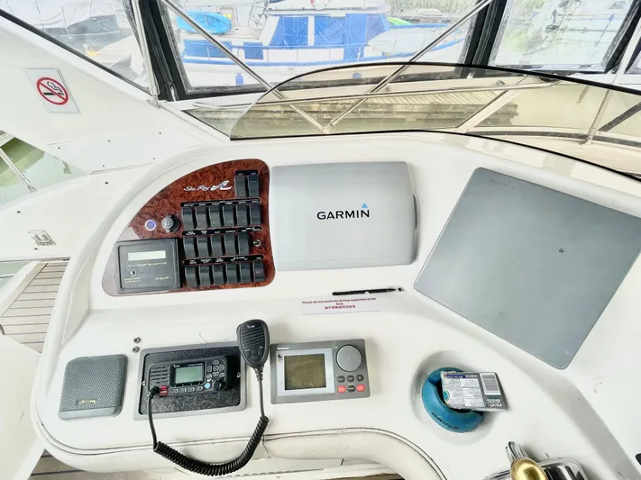 Yacht Photos Pics Control panel of a 2000 Sea Ray 450 Express Bridge with Garmin navigation system.