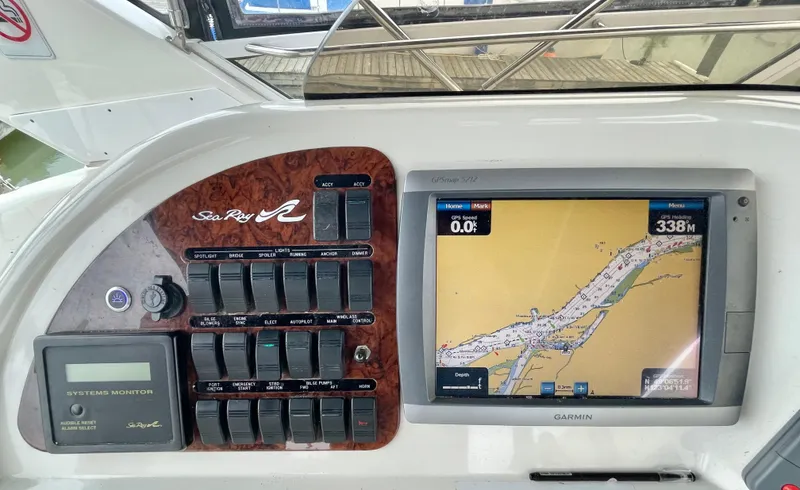  Yacht Photos Pics Control panel of 2000 Sea Ray 450 Express Bridge with navigation display and switches.