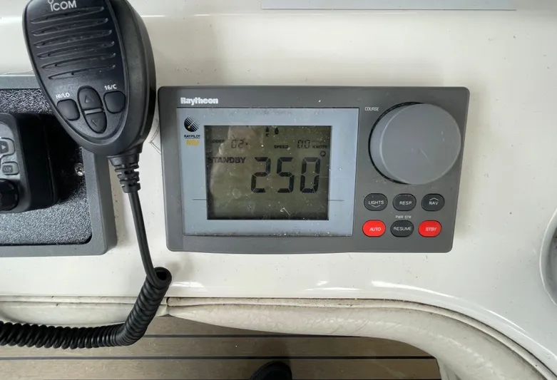  Yacht Photos Pics Control panel of a 2000 Sea Ray 450 Express Bridge with Raytheon display and Icom microphone.