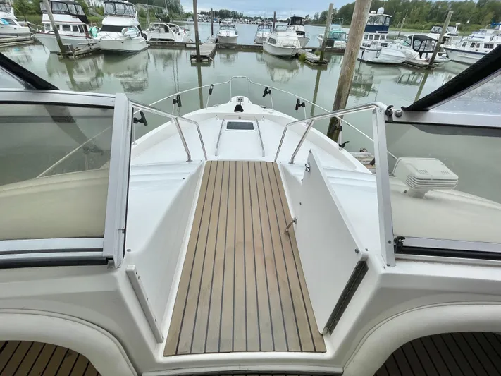  Yacht Photos Pics 2000 Sea Ray 450 Express Bridge yacht docked at marina, view from deck.