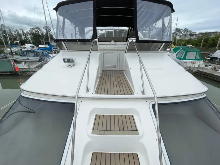  Yacht Photos Pics 2000 Sea Ray 450 Express Bridge yacht with sleek deck and modern design.